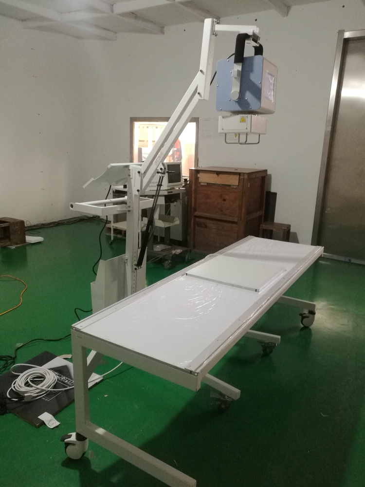 portable x ray with white mobile stand and table